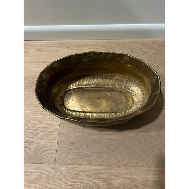 Beautiful vintage hammered brass bowl. This item has many uses. It has a scalloped and hammered detail. It is solid brass...