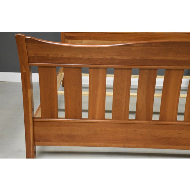 A solid cherry king size bed with a vertical slat headboard made by Richardson Brothers Company. Comes with a headboard,...