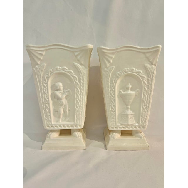Late 20th Century Neoclassical Cream Ceramic Putti Pedestal Vases – A Pair For Sale - Image 9 of 12