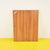 This charming designer mirror features a distinctive frame with a geometric pattern and a vivid color contrast between...