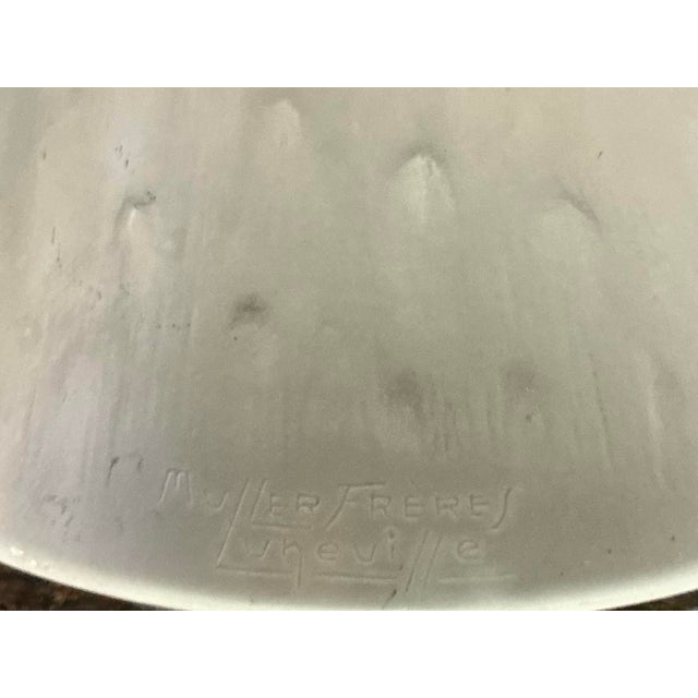This large pending light with a geometric motive was produced by famous “muller freres luneville” in france in the 1920s....
