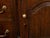 An English Georgian period oak dresser base from the early 19th century, with five drawers, two doors, brass hardware and...