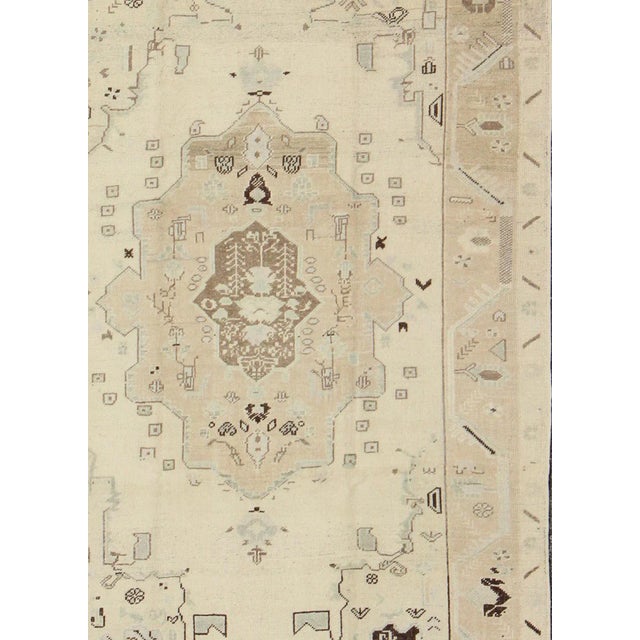 Measures: 5'7 x 8'7. Vintage Turkish Oushak Rug in Soft Cream with Faded Taupe and Subtle Sky Blue. Keivan Woven Arts /...
