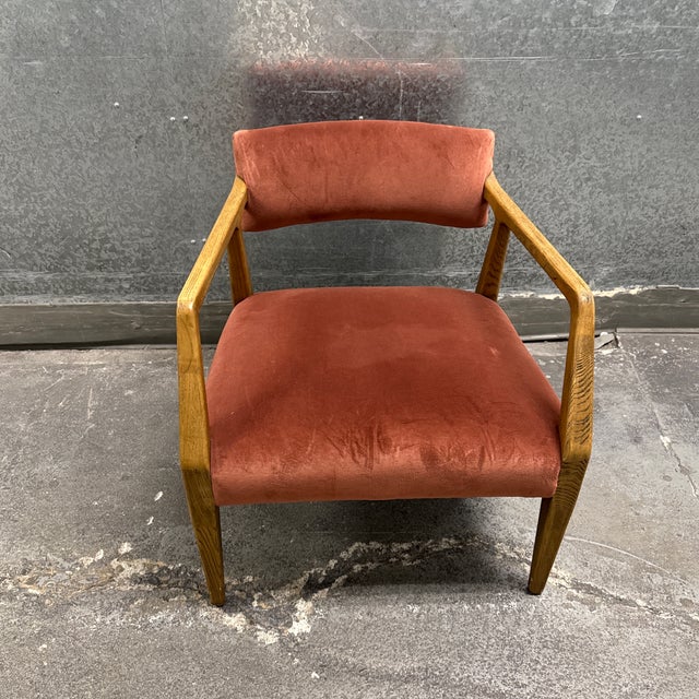 Design Plus Gallery presents the Tyler Armchair from Four Hands. A sculpted oak frame flows into tapered legs and open...