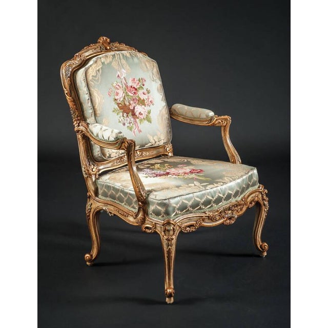 Handcrafted in Italy, this French armchair features a carved European wood frame with a 17" seat height and 27" arm height.