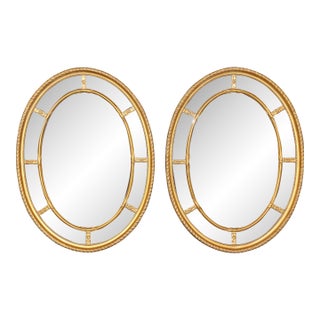 Pair of Beveled Glass Oval Neoclassical Style Gilded Mirrors For Sale