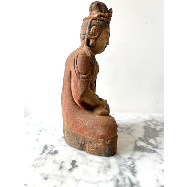 Guan Yin Meditating Buddha Carved Wood Figure. Guanyin is the revered Bodhisattva of Compassion in East Asian Buddhism,...