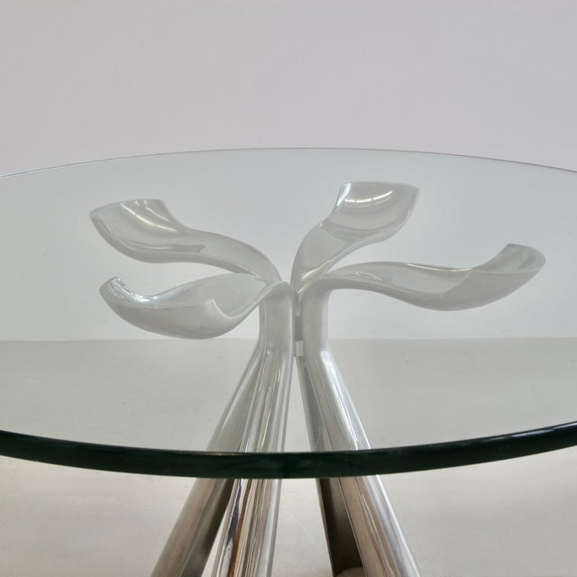 Round Table with polished metal base designed by Vittorio Introini. Italy, Saporiti, 1972. Cast aluminium base in the...