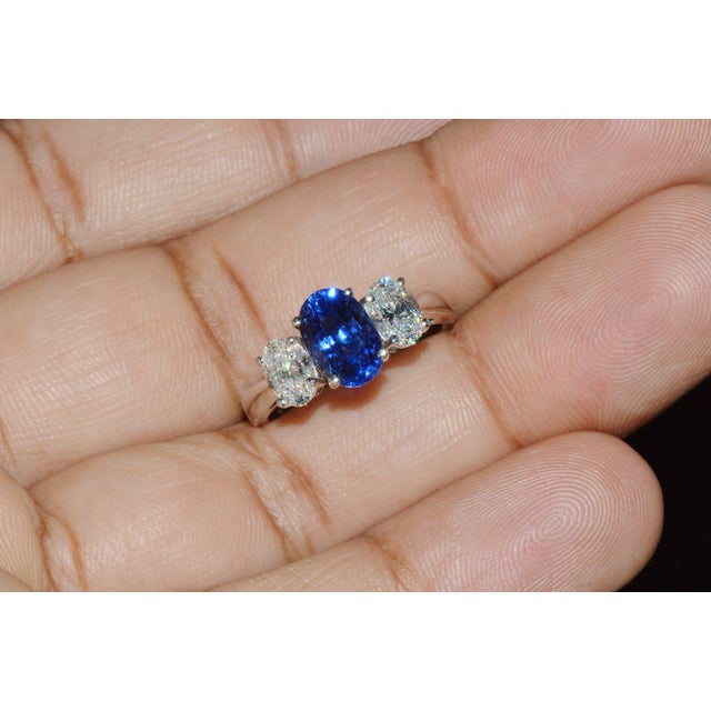 GIA certified 3.61CTS diamond and sapphire three stone solid 950 platinum ring. This ring features a stunning GIA...