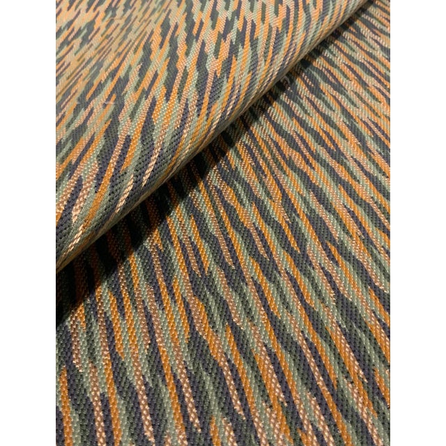 This stylish abstract woven fabric will add a timeless pop of color to anyroom. It has a navy blue, green, gold, and khaki...