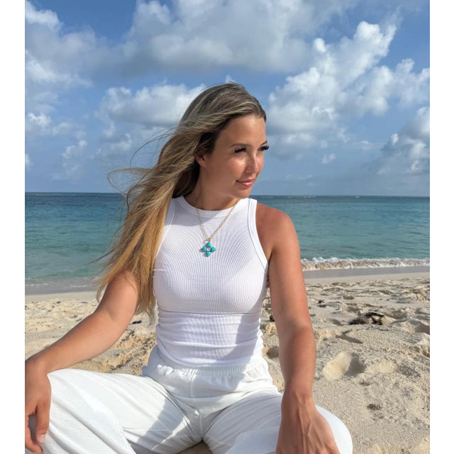 Pristine Natural, Turquoise is paired with Mother of Pearl Doublet and gold chain. Necklace adjustable down to any length...
