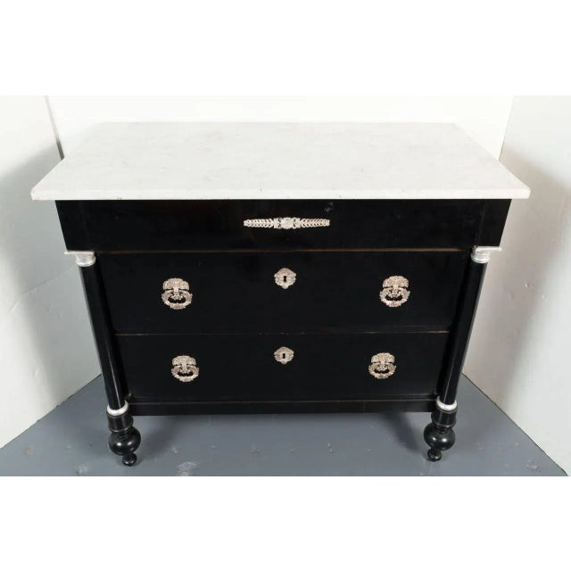 Hand-carved and finished, Northern Italian, three-drawer Neoclassical commode with white, Carrara marble top above...