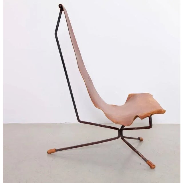 Rare Wenger lotus chair with a beautiful patina and original leather seat. The new version has a leather string stitching...