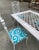 Wood 1970s White Wicker Dining Table With Metal Chairs and Blue Accent Cushions For Sale - Image 7 of 9