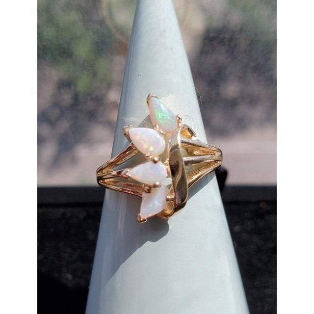 ♥ Product Summary ♥ Main Stone: Australian Opal Weight: 3 grams Stone Cut: Pear Band Material: 10k Yellow Gold **Due to...