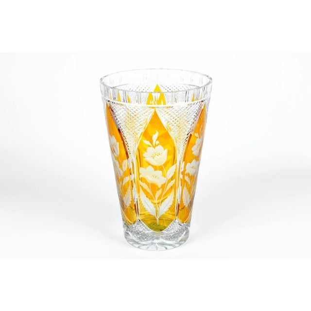 Vintage crystal vase cut with floral design in amber and clear.