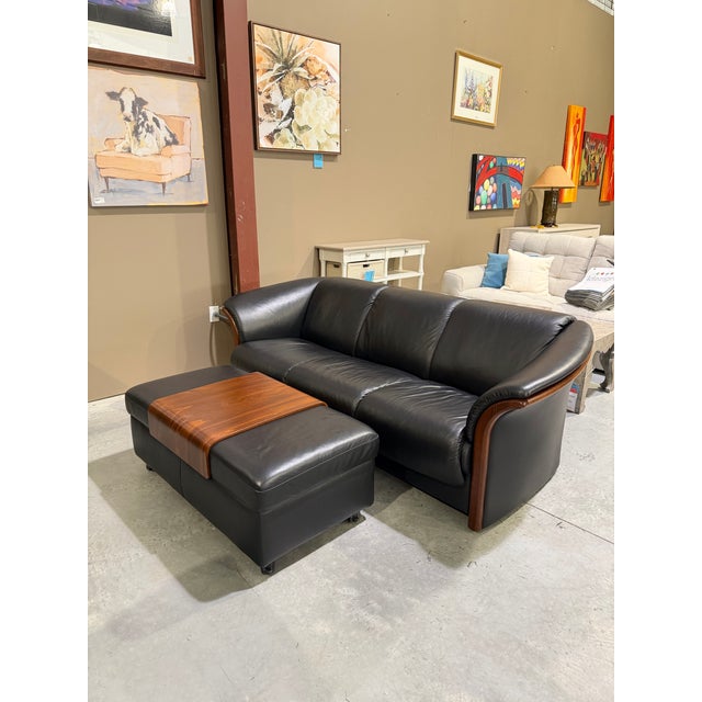 A sophisticated Stressless double ottoman by Ekornes, combining Scandinavian craftsmanship with versatile contemporary...