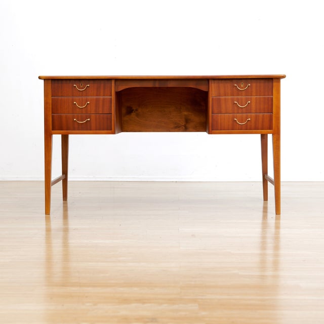 Danish mid-century desk manufactured in the 1960s. Nice Mahogany writing desk with solid brass handles it has its original...
