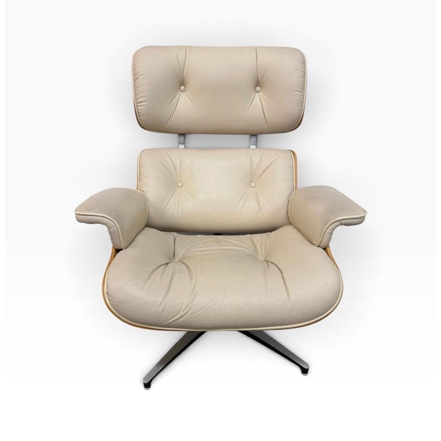 A striking Mid-Century Modern Plycraft walnut swivel lounge chair and matching ottoman, circa 1960s. Produced by Plycraft,...