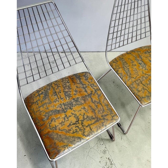 A refined and exclusive set of four Harry Bertoia-style dining chairs, crafted in Italy in the 1970s, featuring a bold...