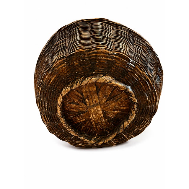 A wonderfully rustic vintage French-style gathering basket, dating to approximately the 1940s. This substantial basket...