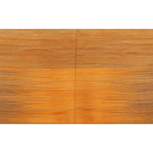 This Modern Kilim Rug is a radiant expression of contemporary minimalism and traditional craftsmanship. Measuring 8' x 6',...