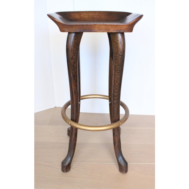 1979 Set of three Jean of Topanga hand carved bar stools. Made of solid hickory with Stylishly unique antique brass...