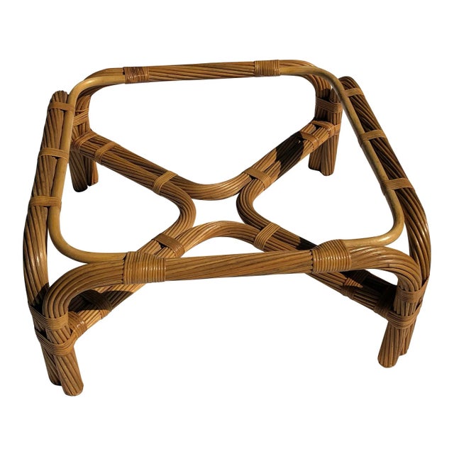 Nicely preserved vintage rattan coffee table, reeds are twisted rope look. Sturdy made piece with cross bar base and...