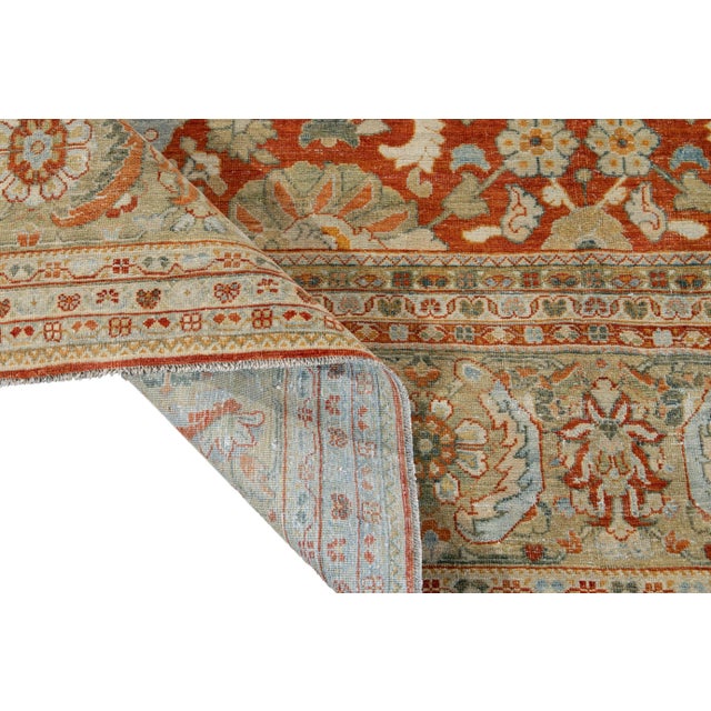 Beautiful vintage Persian Tabriz hand-knotted wool rug with a red field. This Tabriz has accents of blue, beige, and ivory...