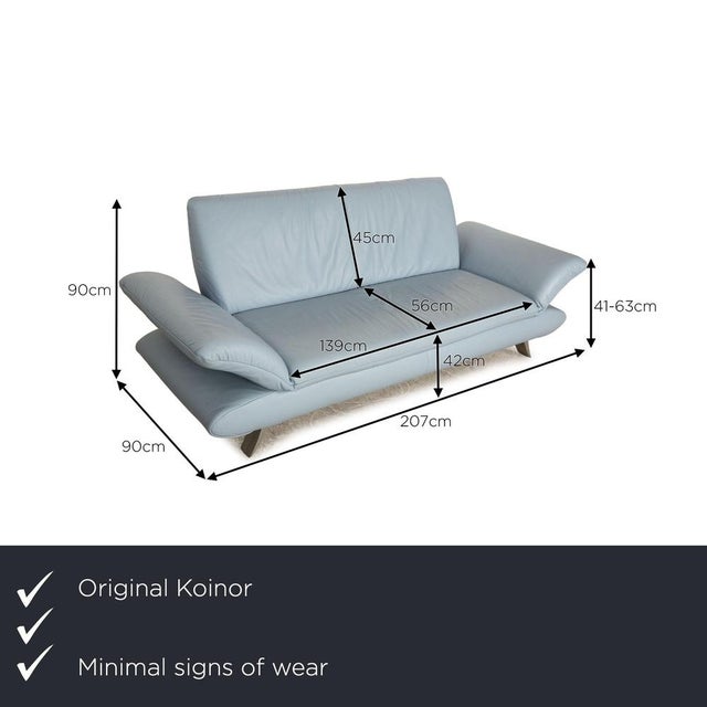 The Rossini sofa from Koinor is covered in light blue genuine leather and stands on silver metal feet. The minimalist...