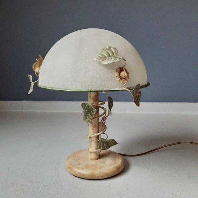 This 1980s lamp from the Dutch company Herda (1946 – 1997) features a metal frame and a heavy shade of frosted/scavo...