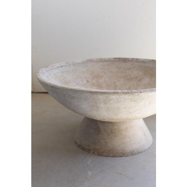 A striking pair of mid-century modern “saucer” planters. Each planter features a wide, shallow bowl resting elegantly on a...