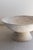 A striking pair of mid-century modern “saucer” planters. Each planter features a wide, shallow bowl resting elegantly on a...