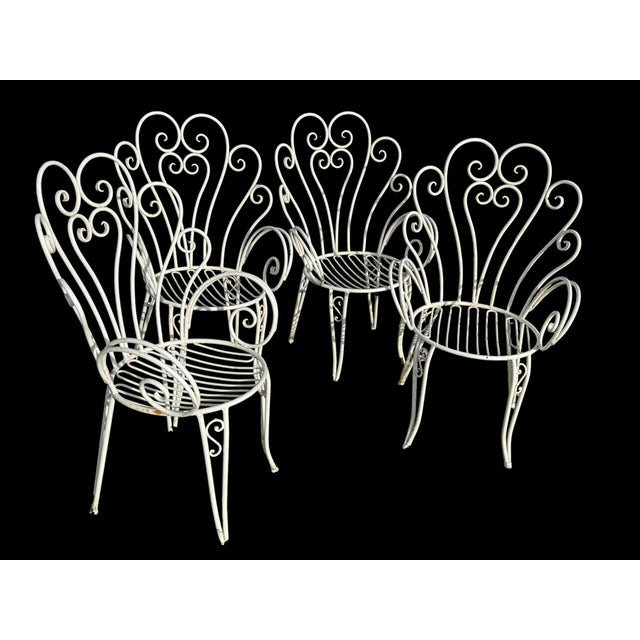 Sets of Provençal wrought iron armchairs, handcrafted in the Avignon region. Set of 4