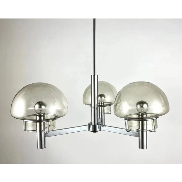 A beautiful and stylish model from the italian brand stilnovo, 1970s. the pendant fixture is made of metal silver colored...