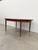 Authentic vintage mid century modern teak extendable dining table with built-in leaf. By G Plan. Maker's label on bottom...