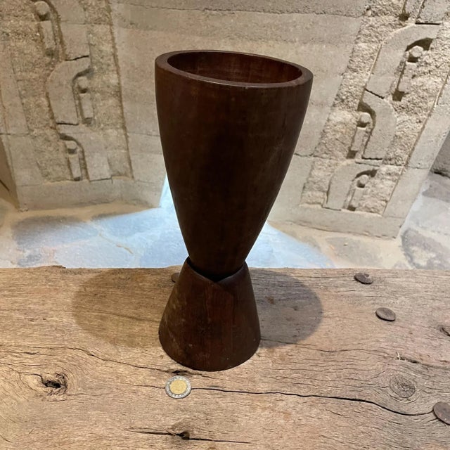 AMBIANIC presents heavy solid wood vase manner of Don Shoemaker made Mexico 1970s. Crafted in palo fierro Unmarked. 11.5 H...