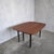 A proper piece of British mid-century design—this G Plan Librenza drop leaf dining table is as clever as it is good-...
