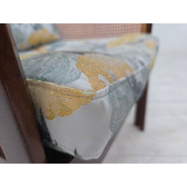 1970s, Danish design by Illum Wikkelsø. Armchair model "Plexus". Laqered teak wood, flowers furniture fabric, furniture...