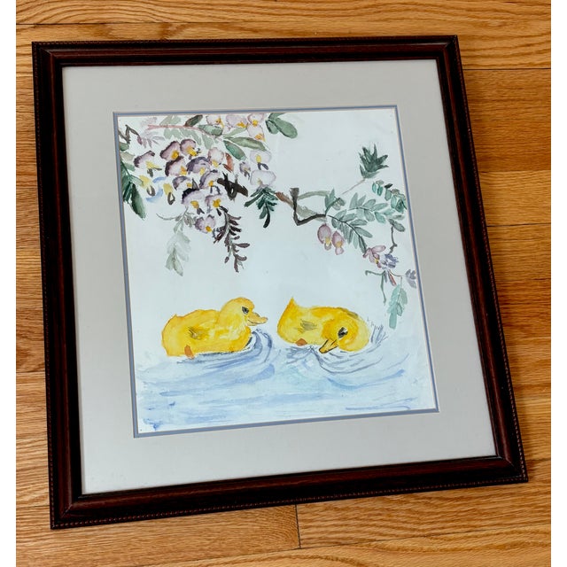 Charming folk art framed watercolor painting of a duckling pair below some flowering branches. Please see condition...