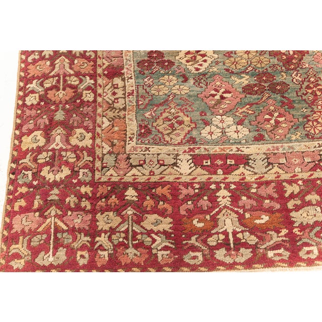 Turkish Antique Turkish Ghiordes Rug with Floral Design For Sale - Image 3 of 7