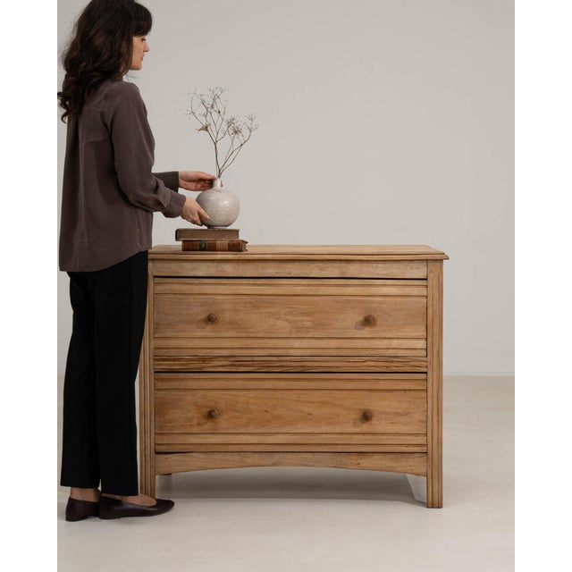 Here is a chest of drawers, its natural bleached oak, 2 drawers the first thing to catch the eye. Originating in France...