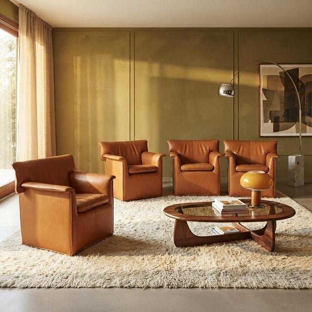 Four 'Laurianetta' model armchairs designed by Afra and Tobia Scarpa and produced by B&B Italia in the 1980s. The...