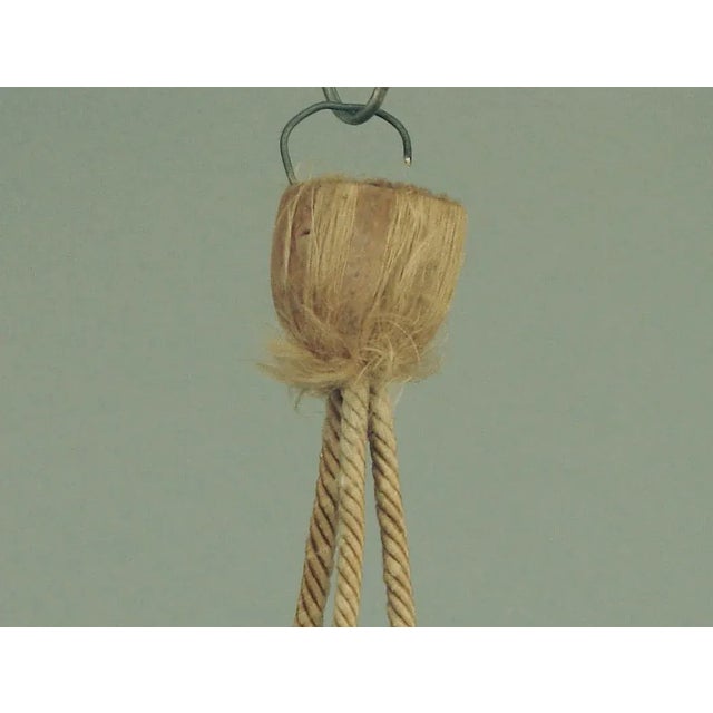 Offering a colorful, charming hanging pottery bowl hanging by a vintage French “Cordelier,” the type with which lighting...