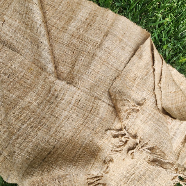 A hand spun and hand woven raw silk throw. Also great for pillows or table runner. Natural tobacco color.