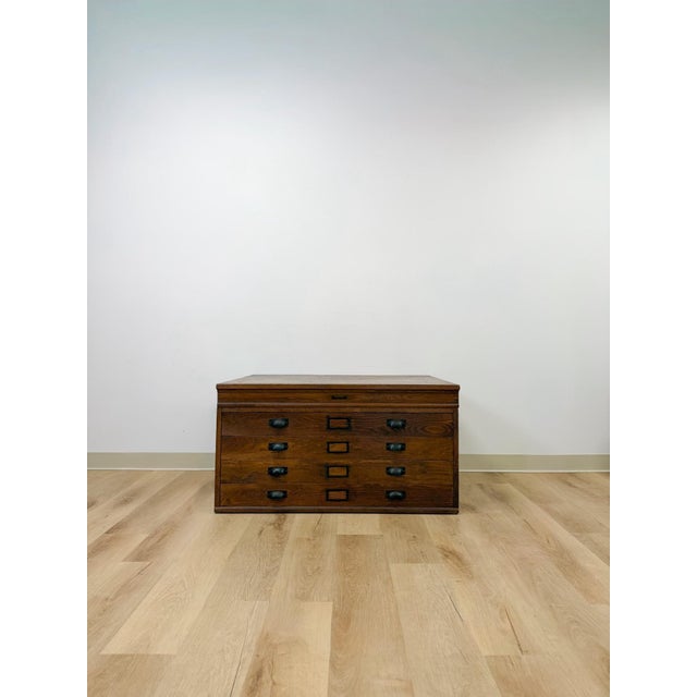 This antique Hamilton printing cabinet offers a genuine piece of industrial history, originally designed to house typeset...