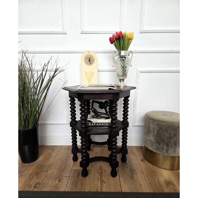 Beautiful antique Italian solid walnut side table or stool features hexagonal top with beveled edges over six beautifully...