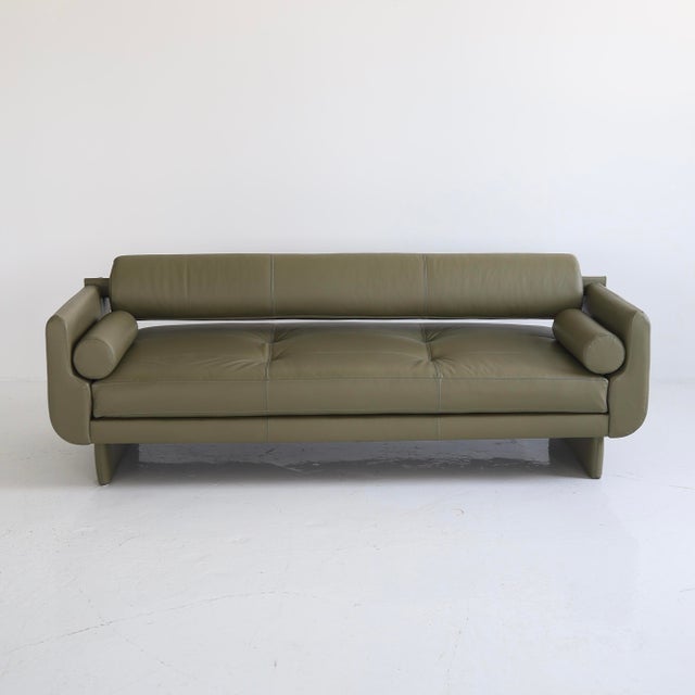this piece is in excellent, restored condition. It has been fully reupholstered in Maharam “Pace” leather