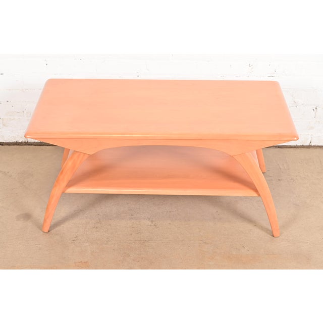 A gorgeous Mid-Century Modern coffee table or cocktail table By Heywood Wakefield USA, 1950s Sculpted solid maple, with...