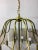 Gold-colored, 12-burner copper chandelier with smoked glass panels with polished edges. Elegant, clean design that...